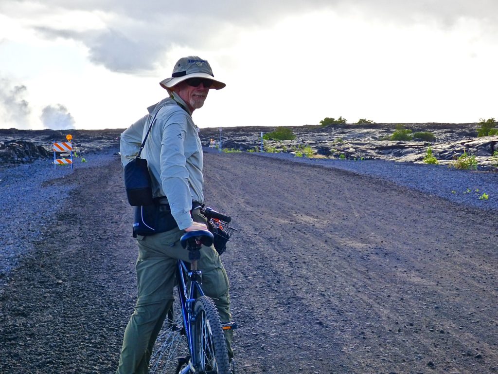 Jack on a bicycle riding to the. molten lava.