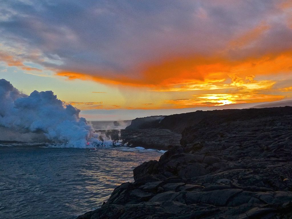 Sunset added to the drama of molten lava going into the ocean.