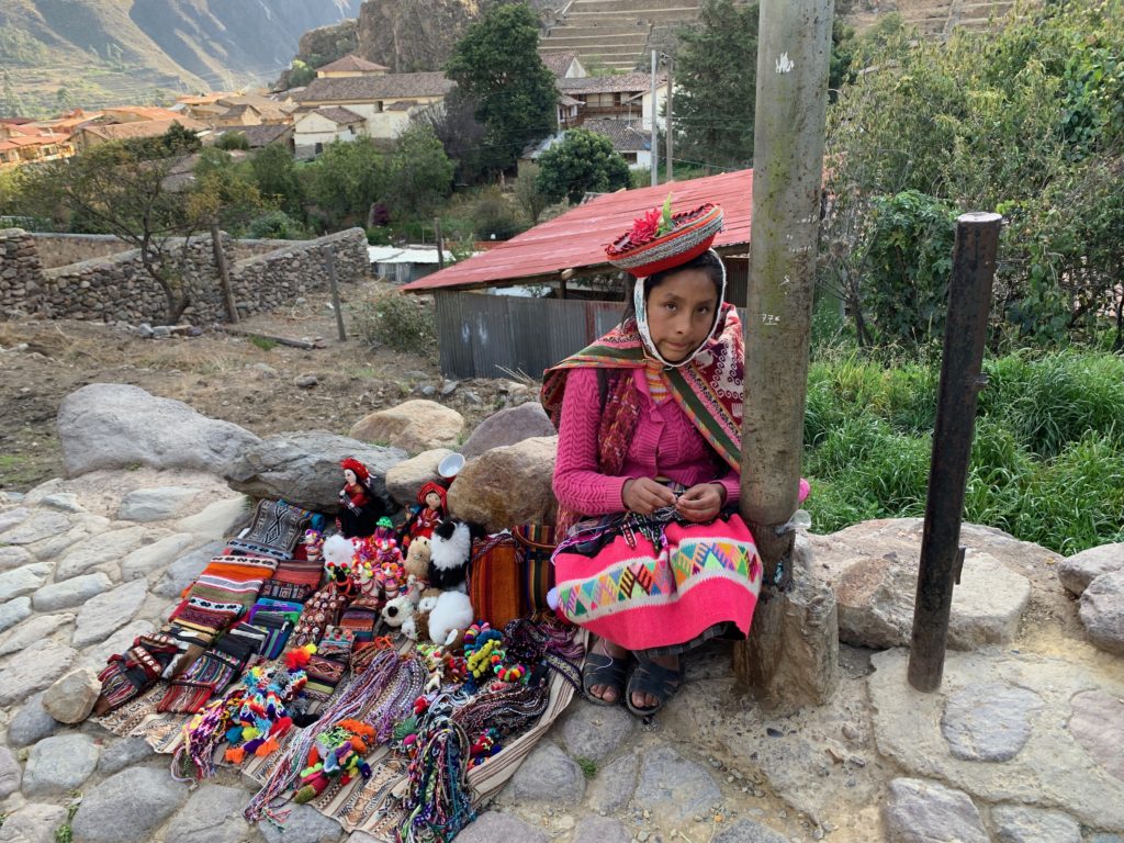 Basic Spanish is necessary to purchase items from this local girl selling her wares along the walkway.