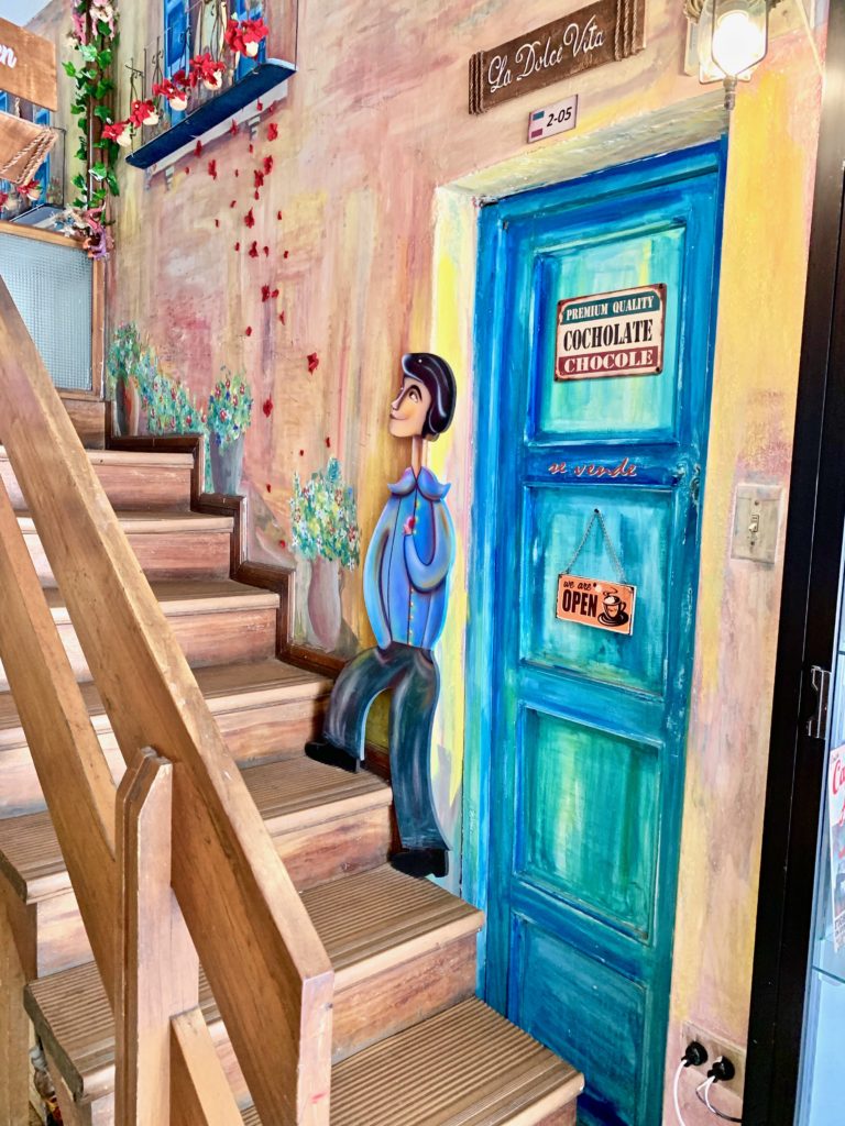 Painted image of man gong up step