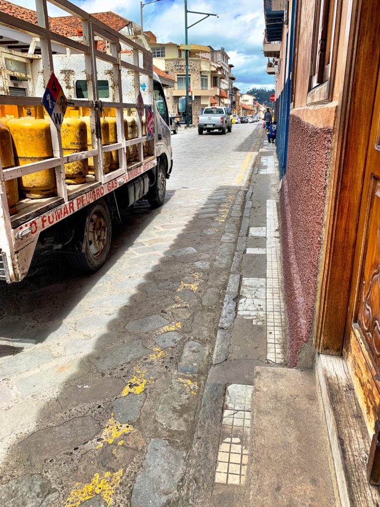 Width changes on Cuenca sidewalk.
