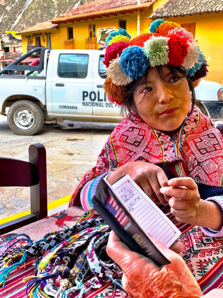 Local girl selling small bracelets.  Safe travels by having small change handy.