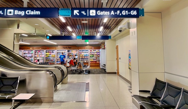 after arriving on the flight from Kauai to Oahu, you go up the escalator