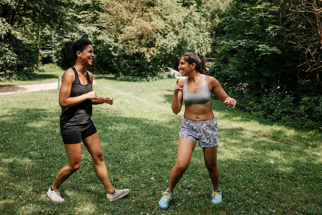 two women working out outdoors