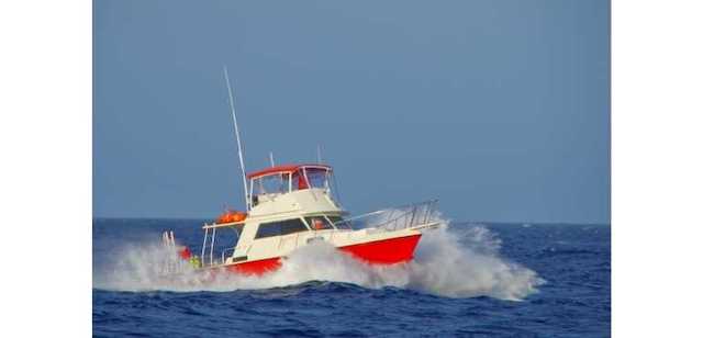 Power boat in rough seas.  