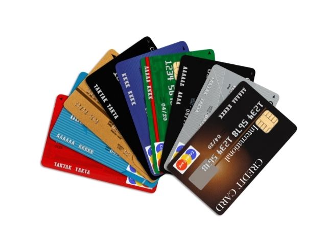 a spread of credit cards, some of which provide a companion certificate.