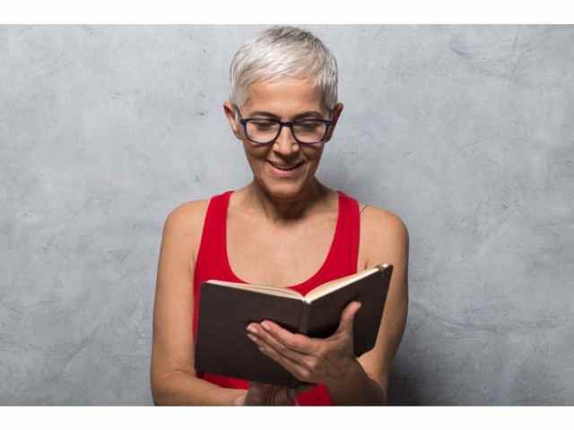 Woman reading a good travel book