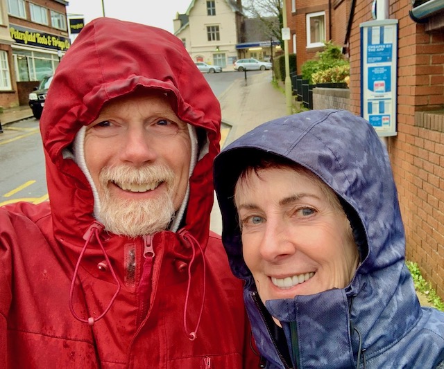 Traveling pet sitters in the rain in the UK.