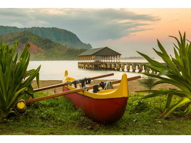 Beautiful Hanalei Bay with the dock and an outrigger canoe