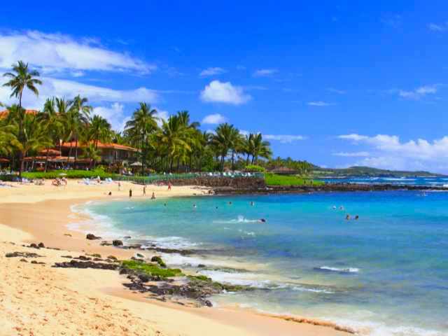 Poipu beach which is a favorite of many during their Kauai vacation