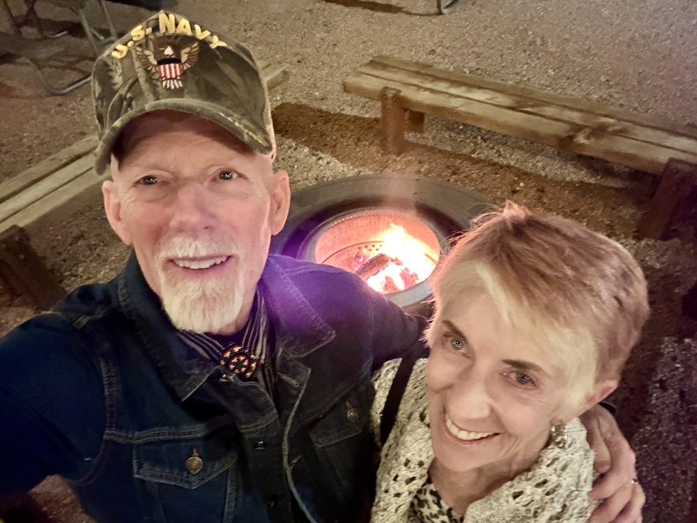 Two people at the campfire at the Marble Canyon Lodge in Marble Canyon AZ