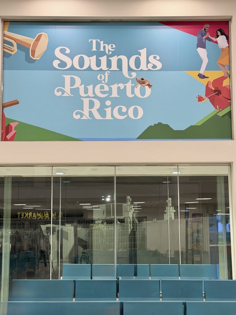 Sign in the San Juan airport that says "the sound of Puerto Rico."