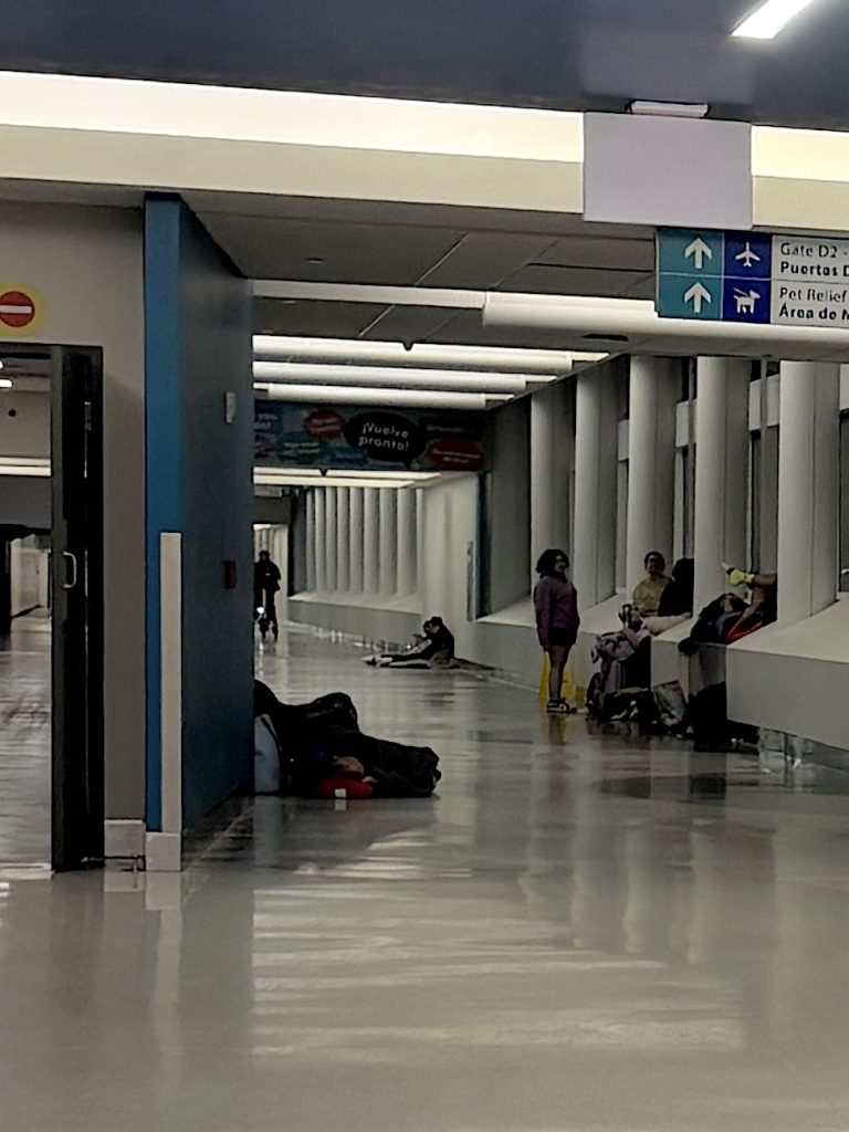 People seen sleeping on the floor in the San Juan airport as we made our way to the San Juan airport hotel